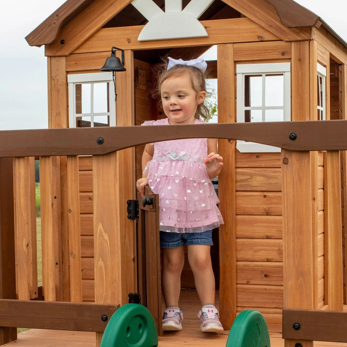 Backyard Discovery Echo Heights Cedar Wooden Elevated Kids Playhouse with Wave Slide, Play Kitchen, and Deck